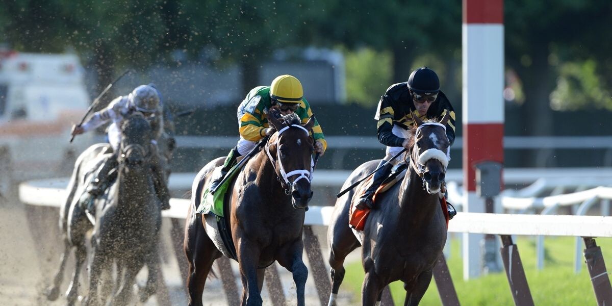 Palace Malice passes Oxbow in the 2013 Belmont Stakes (Photo by Joe Labozzetta/Coglianese Photos)