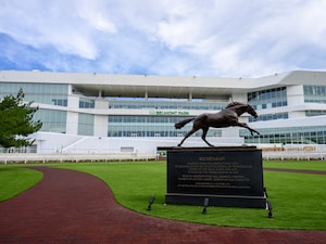 The Secretariat statue with the new Belmont Park grandstand