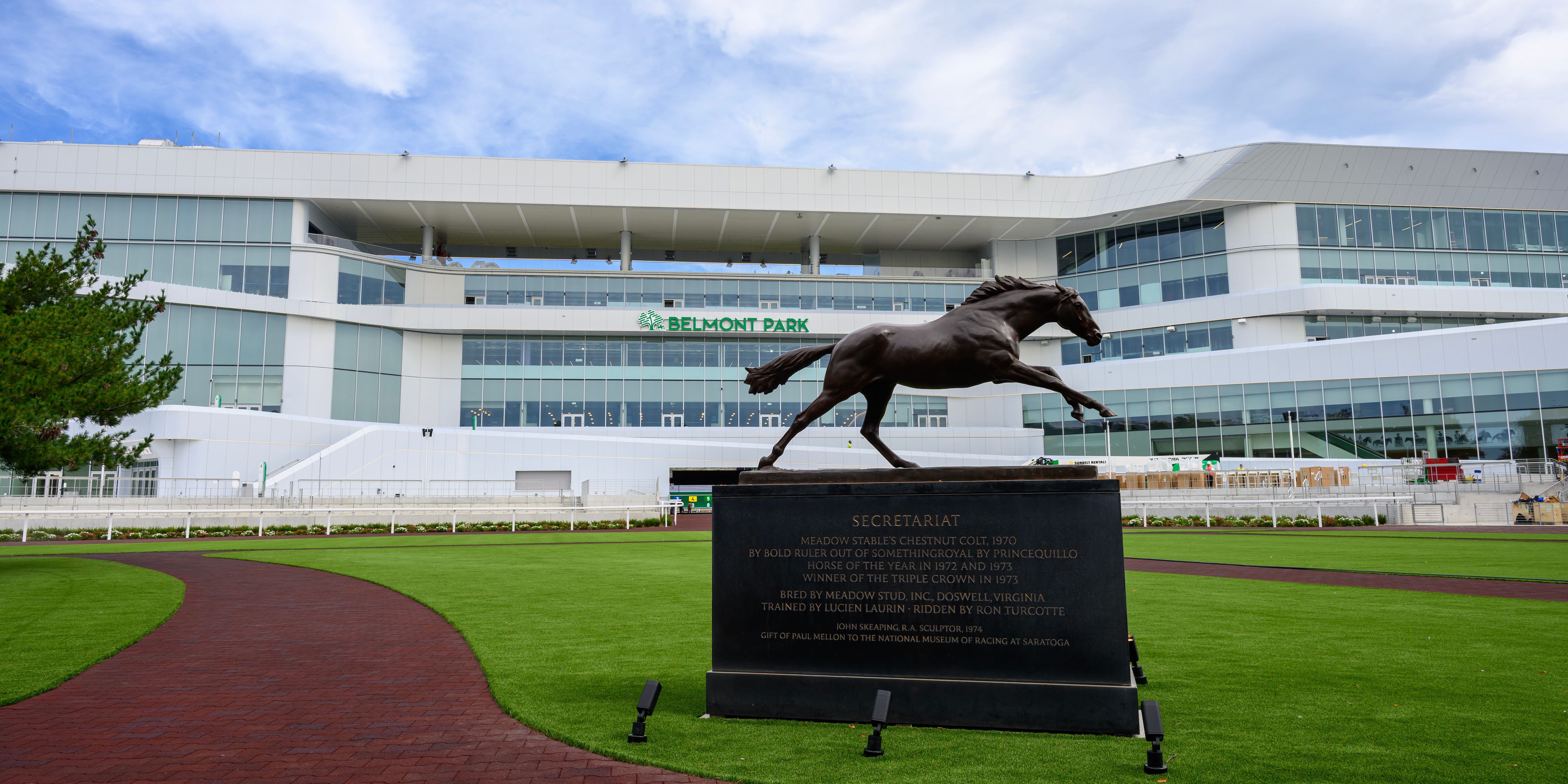 The Secretariat statue with the new Belmont Park grandstand
