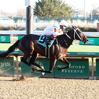 Carbone winning his debut at Churchill Downs (Photo by Coady Photography)