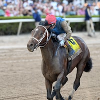 Commandment wins the Florida Derby at Gulfstream Park.