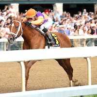 Further Ado wins the Blue Grass Stakes at Keeneland.