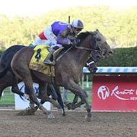 Hill Road swept from well off the pace in the Peter Pan