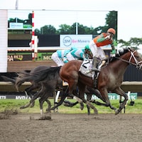 Journalism wins the Haskell at Monmouth Park. 