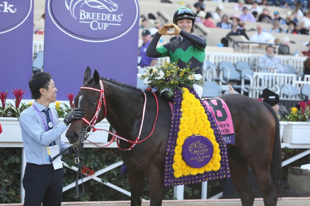 Loves Only You in the winner's circle after the Breeders' Cup Filly & Mare Turf