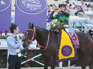 Loves Only You in the winner's circle after the Breeders' Cup Filly & Mare Turf