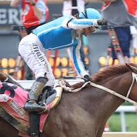 Mage winning the Kentucky Derby (G1) at Churchill Downs (Photo by Horsephotos.com)