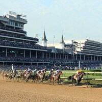 The field rounds the first turn in the 2016 Kentucky Derby