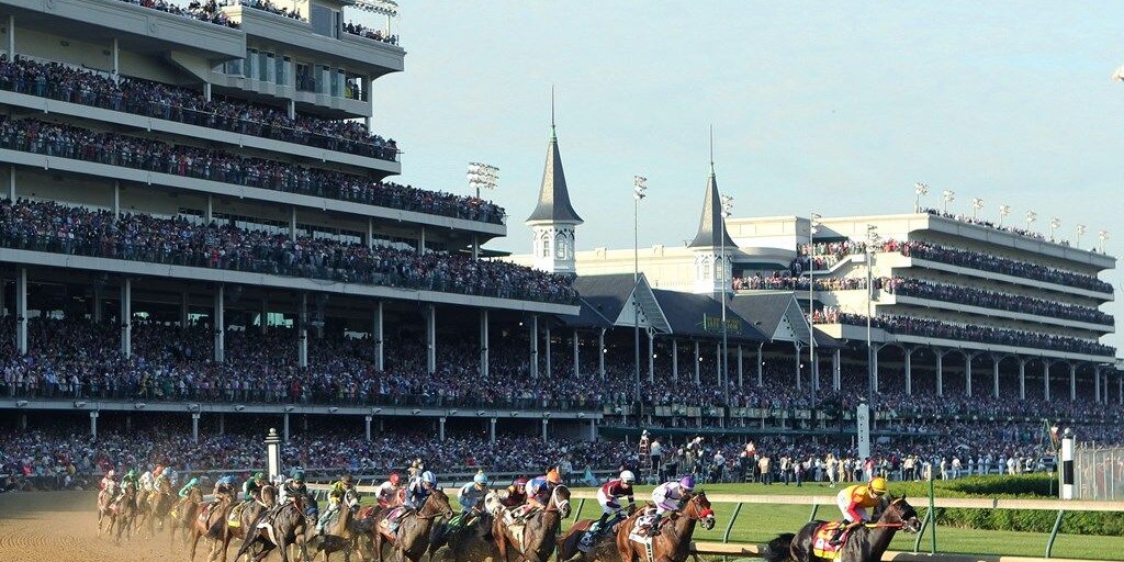 The field rounds the first turn in the 2016 Kentucky Derby