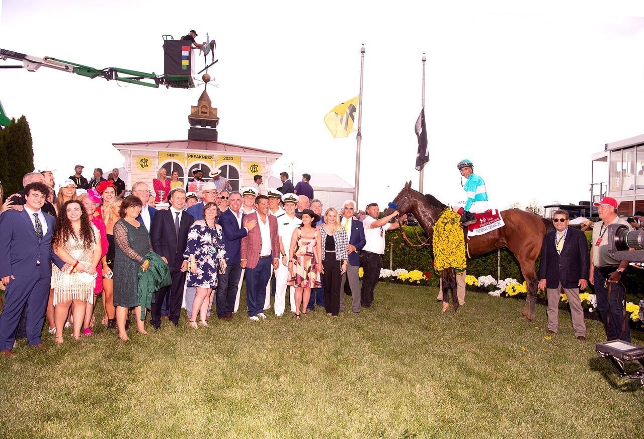 National Treasure and connections in the winner's circle of the Preakness Stakes