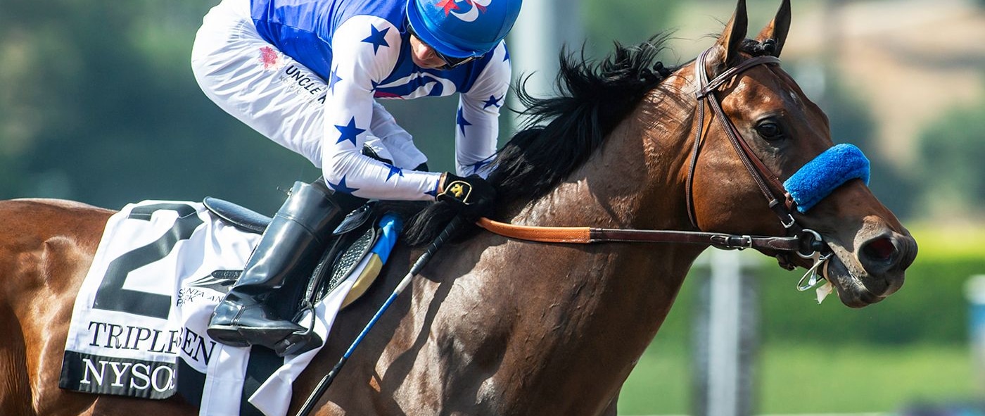 Juan Hernandez looks for competition aboard Nysos in the Triple Bend