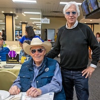 Legendary trainers D. Wayne Lukas (seated) and Bob Baffert (standing)