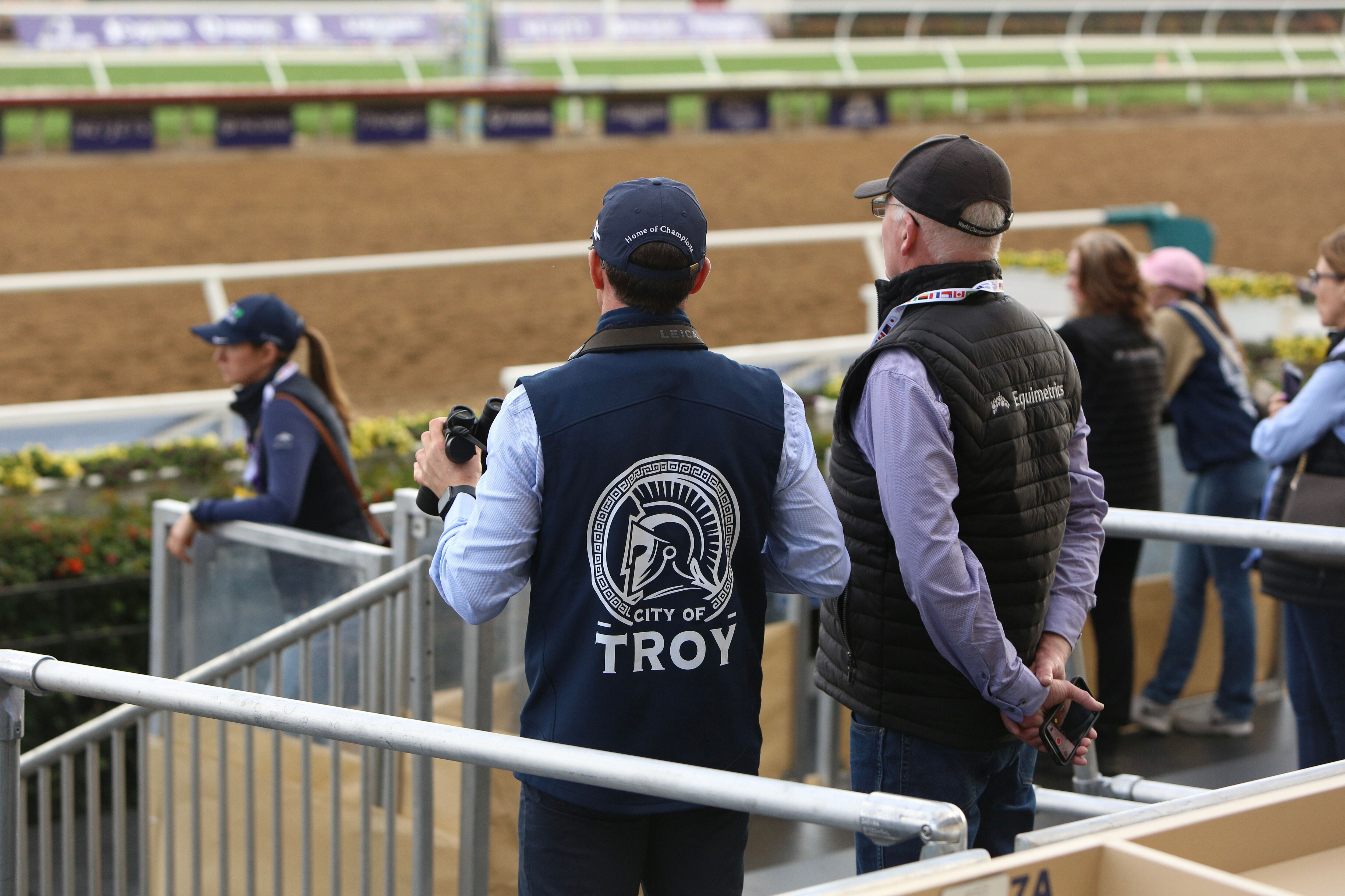 One of City of Troy's entourage sports a jacket with a custom-made Trojan helmet logo