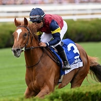 Kensington Lane winning the Belmont Oaks (G1) at Saratoga.
